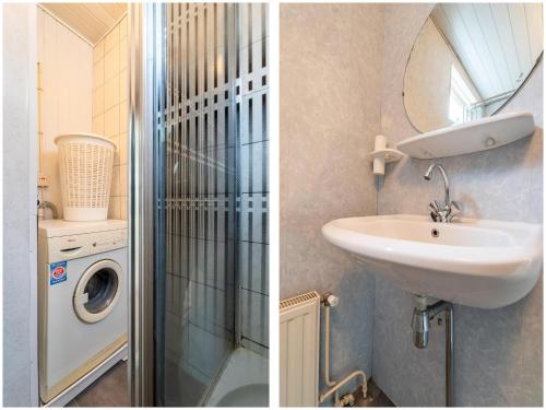 a bathroom with a sink and a washing machine at Waterside stay with Private Jetty in Heeg