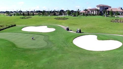 a golf course with two hearts on the green at Resort Style, close to Disney and other parks in Davenport