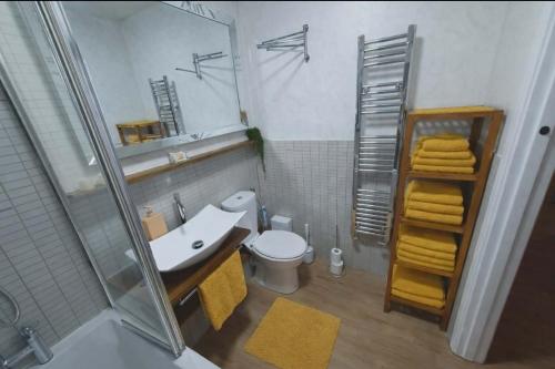 a bathroom with a sink and a toilet and a shower at Luxury Smart Apartment Slough, Sleeps 5, Garden, Parking, Spa-Style Bathroom in Slough