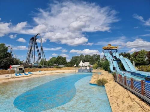 a roller coaster at a water park at Luxury Smart Apartment Slough, Sleeps 5, Garden, Parking, Spa-Style Bathroom in Slough