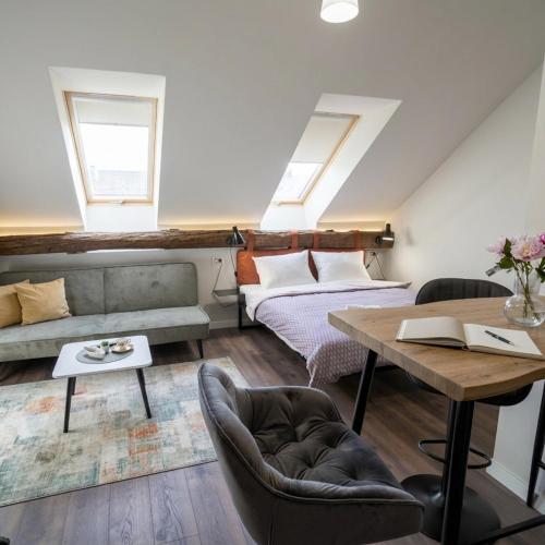 a living room with a couch and a table at Elidon 1833 in Pančevo