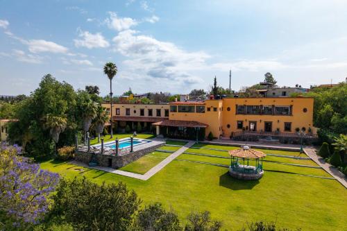 an aerial view of a house with a large yard at Mirador del Frayle in San Miguel de Allende