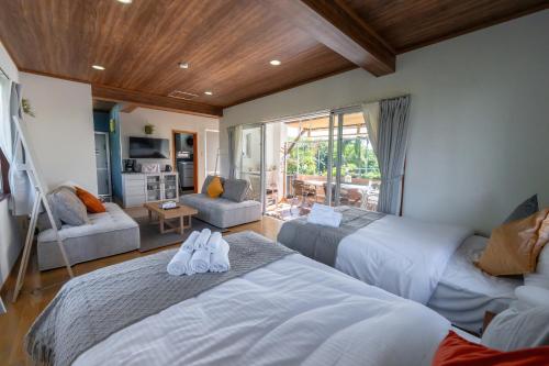 Llit o llits en una habitació de ブーゲンビリア