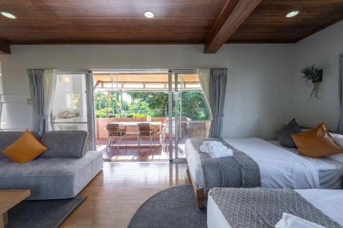 Llit o llits en una habitació de ブーゲンビリア