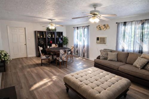 a living room with a couch and a table at Vacation Home 3.5 Mi to Strip/DT/Outlt up to 8 gst in Las Vegas