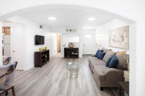 a living room with a couch and a table at Vacation Home 3.5 Mi to Strip/DT/Outlt up to 8 gst in Las Vegas