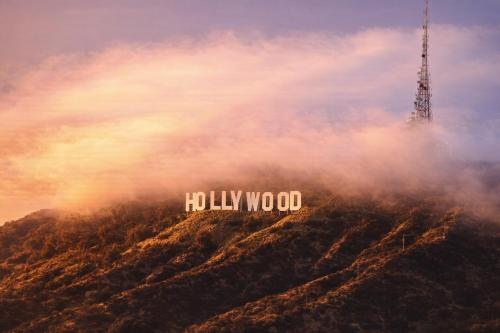 a hollywood sign sitting on top of a mountain at Modern Luxury Oasis in WEHO Hollywood Sign Views in Los Angeles