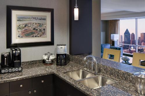 a kitchen with a sink and a counter top at Hyatt Regency Dallas in Dallas