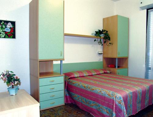 מיטה או מיטות בחדר ב-Hotel Basilea