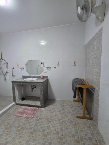 a bathroom with a counter and a sink in a room at Your space surrounded by Nature in Ban Mai Salae