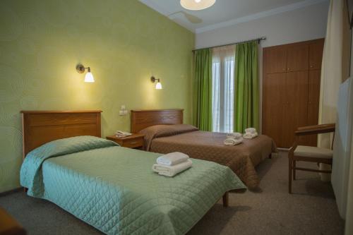 Postel nebo postele na pokoji v ubytování Hotel Liberty