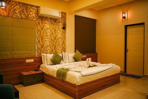 a bedroom with a bed in a room at Lazo EcoSpot Vythiri , Wayanad in Vythiri