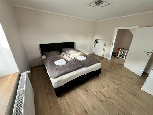 a bedroom with a large bed in a room at Ferienwohnung am Nürburgring in Herresbach