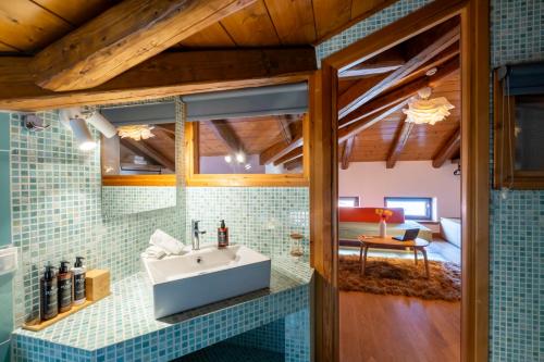 a bathroom with a sink in the middle of a room at Meliades Luxury Villas in Arachova