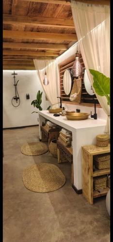 a bathroom with a white desk and a sink at Lahima Cabanas Villa in Dickwella
