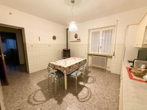 a dining room with a table and chairs in a room at Casa Vacanze da Francesco in Lettopalena