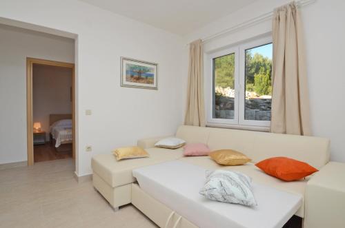 Postel nebo postele na pokoji v ubytování Apartments Surjan