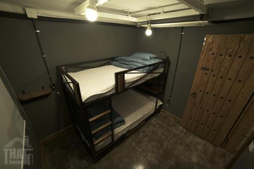 an overhead view of a bunk bed in a room at That House Hongdae in Seoul