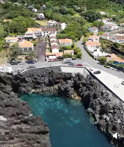 an aerial view of a bridge over a river at Faial Oceanfront Getaway AL in Horta
