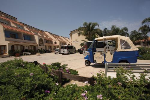 a food truck with a tent parked in a parking lot at Hotel Tropis in Tropea