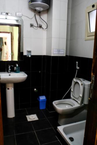a bathroom with a toilet and a sink at Tecoma studios Lighthouse in Dahab