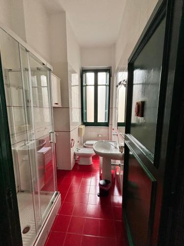 a bathroom with a toilet and a sink at Cosmopolitan Palermo in Palermo