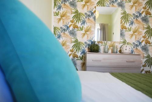 a bedroom with a bed and a large mirror at Marechiaro Pool & Restaurant in Paestum