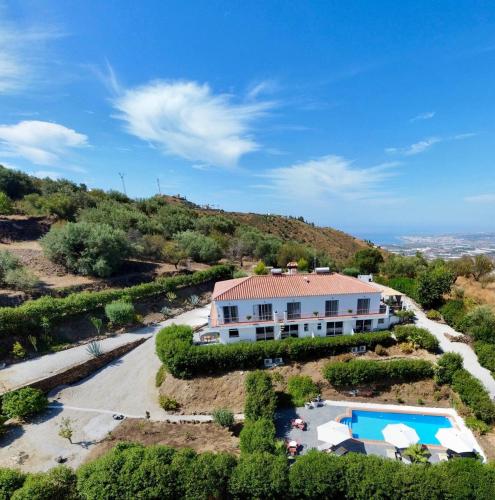 an aerial view of a villa with a swimming pool at Sobremesa Boutique in Sayalonga
