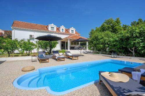 Luxury villa Essencia Milna Brač with heated pool