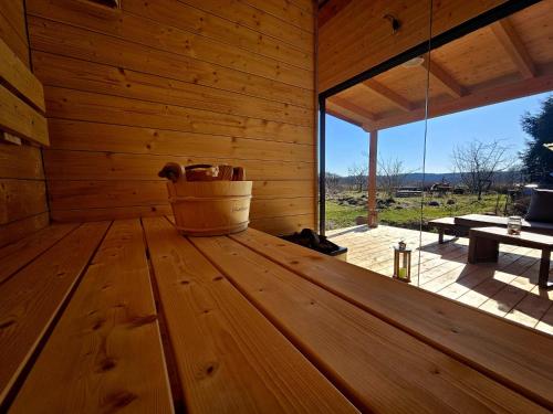 a wooden room with a bucket in the inside of a sauna at Ferienwohnung Peetsch am See in Mirow