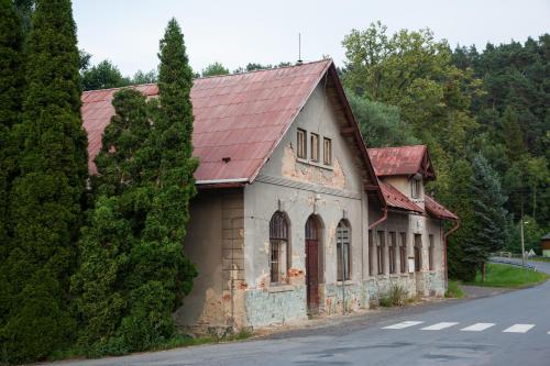 an old building with a red roof on the side of a road at Camping 2000 in Januv Dul