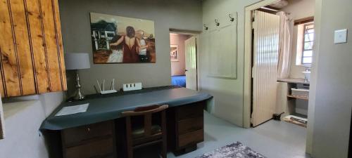 a bathroom with a blue counter top in a room at Ouma Bettie Guesthouse in Piketberg