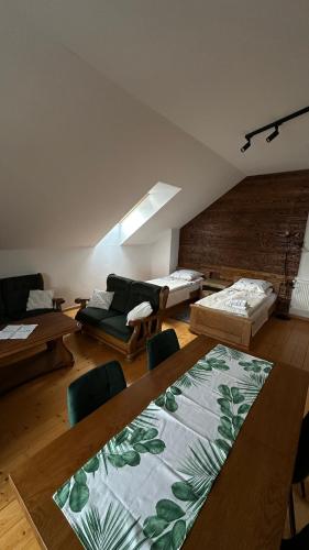 a large living room with a couch and a table at Apartament D&D in Gorlice