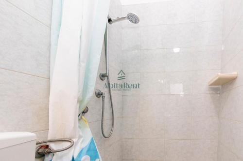 a shower in a bathroom with a shower curtain at La Dimora del Centro - San Foca in San Foca