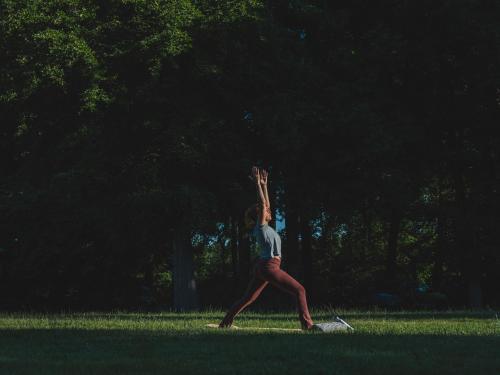 a person is reaching up to catch a frisbee at De Parel - Mystical spaces to discover! in Zeewolde