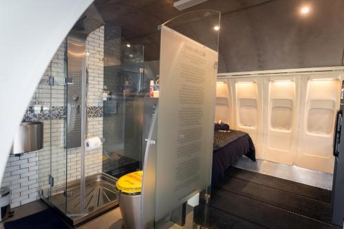 a display of a room with a bed and a shower at Aerotel in Hoedspruit