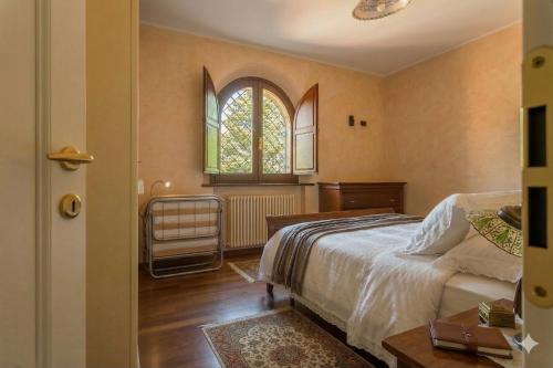 a bedroom with a bed and a window at VILLA TERRABIANCA - Premium Villas in Tortoreto Lido