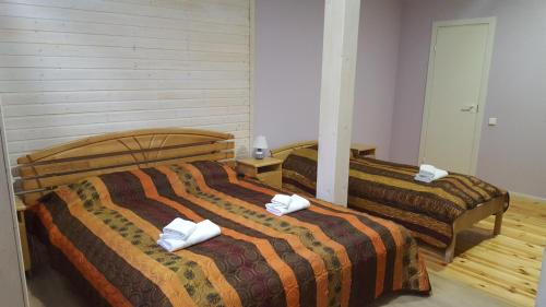 Postel nebo postele na pokoji v ubytování Sunset Hotel