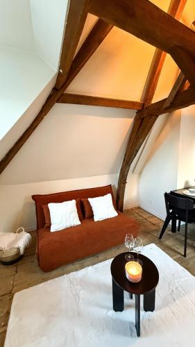 a attic room with a bed and a table at RR4 - Penthouse in Antwerp