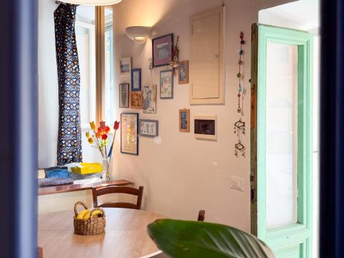a dining room with a table and a window at Casa dell'Artista - HelloElba in Portoferraio