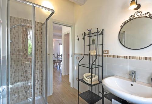 a bathroom with a shower and a sink and a mirror at La Terrazza del Conero La Ginestra in Sirolo