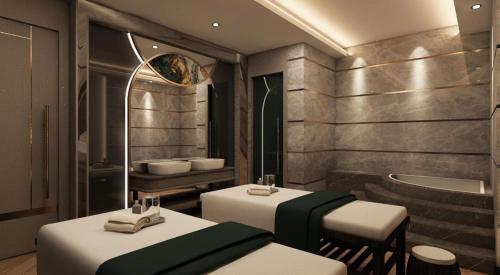 a bathroom with two tables and a bath tub at Doubletree By Hilton Afyonkarahisar in Afyon