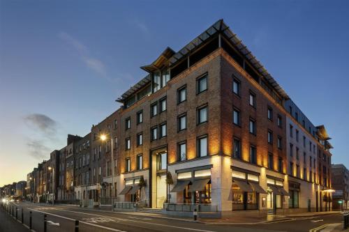 a large brick building on a city street at The Morrison Dublin, Curio Collection by Hilton in Dublin