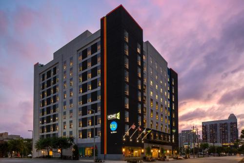 a tall black building with a clock on it at Home2 Suites By Hilton Houston Downtown Convention Center in Houston