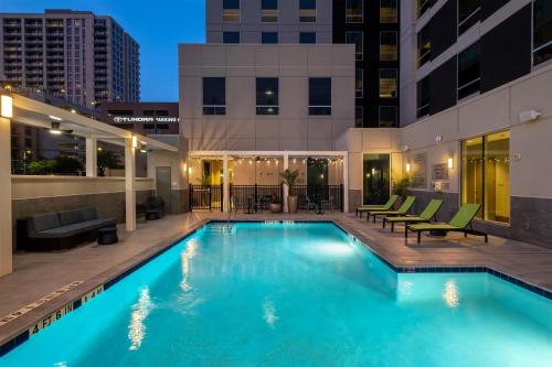 a swimming pool in the middle of a building at Home2 Suites By Hilton Houston Downtown Convention Center in Houston