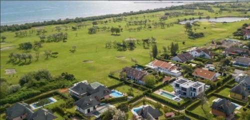 an aerial view of a large estate with houses at Villa Helena, Venetien, Exklusive Villa auf Privatinsel Albarella, 4 Bedrooms 8 Personen, 300 m Strand in Isola Albarella