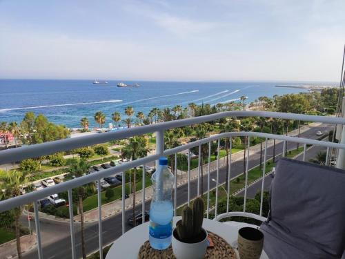 a balcony with a view of the beach and the ocean at SEAFRONT 1BDR, Panoramic views, central Marina in Limassol