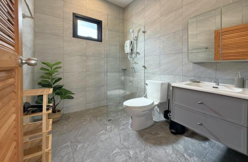 a bathroom with a toilet and a shower and a sink at Samui Kozy Private Pool Villa in Nathon Bay
