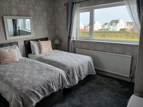 Postel nebo postele na pokoji v ubytování Ceecliff House