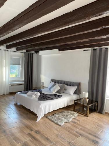 a bedroom with a large bed in a room at Dori Affittacamere in San Lorenzo